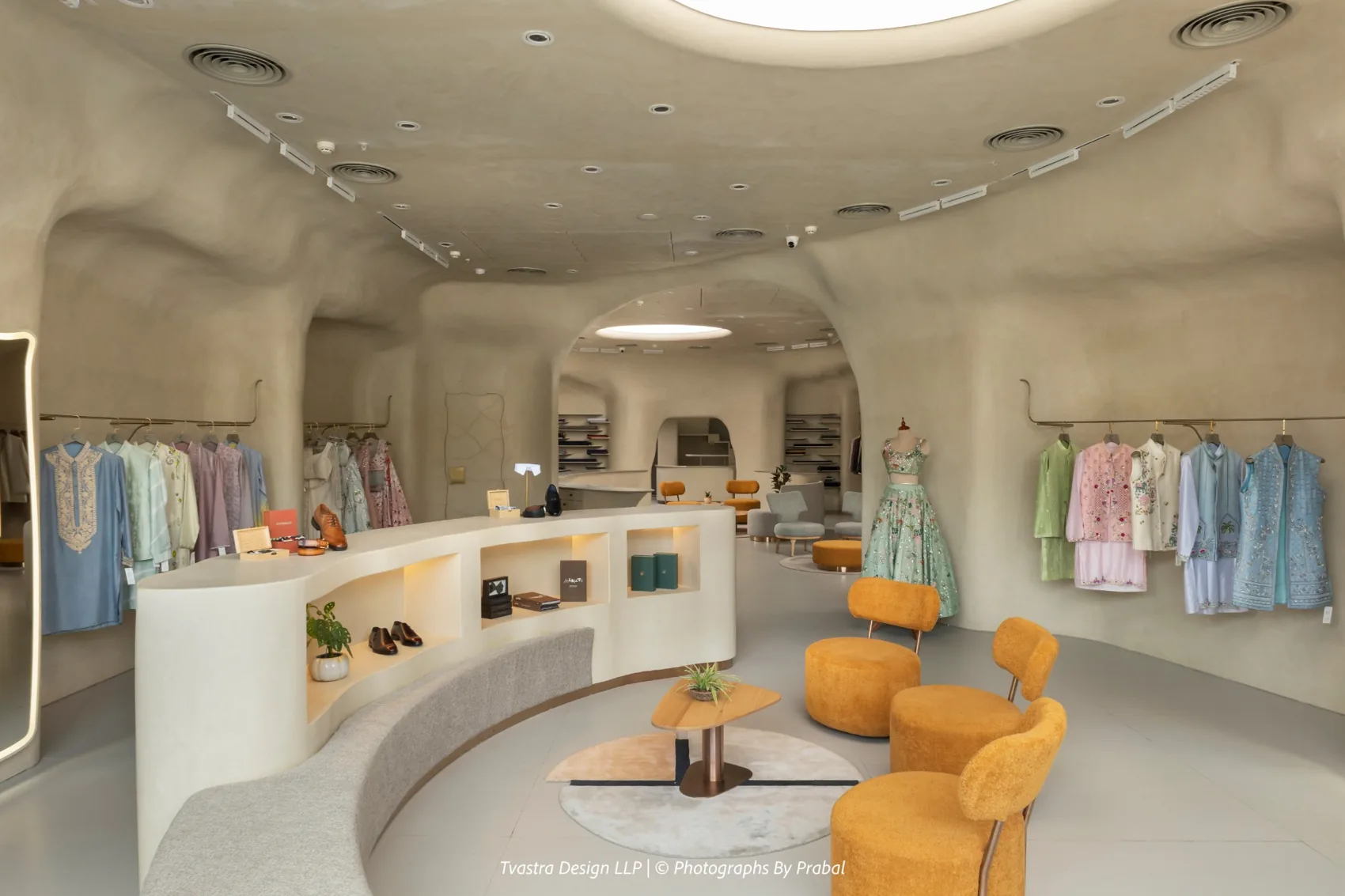 Calibre, curved display walls and seating under the skylight