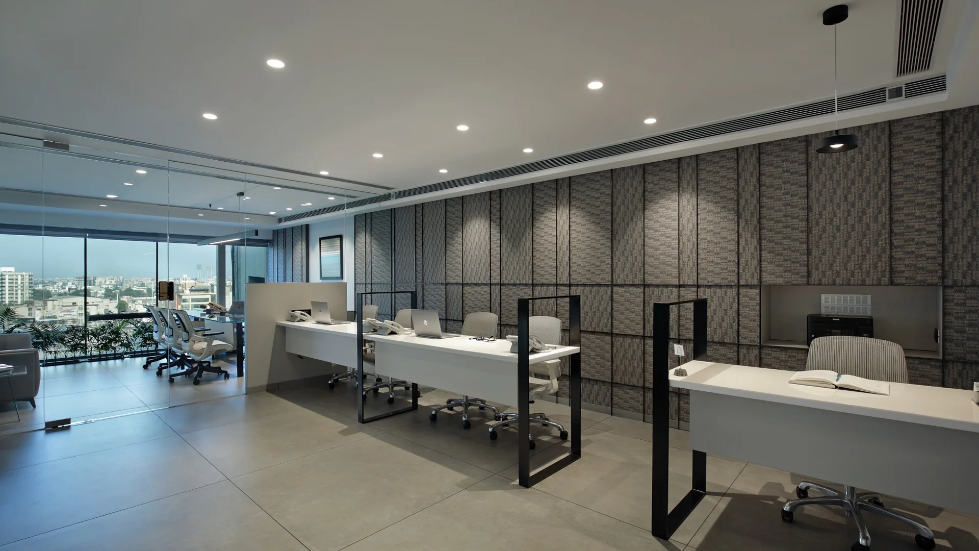 ICON, task desks along the textured feature wall