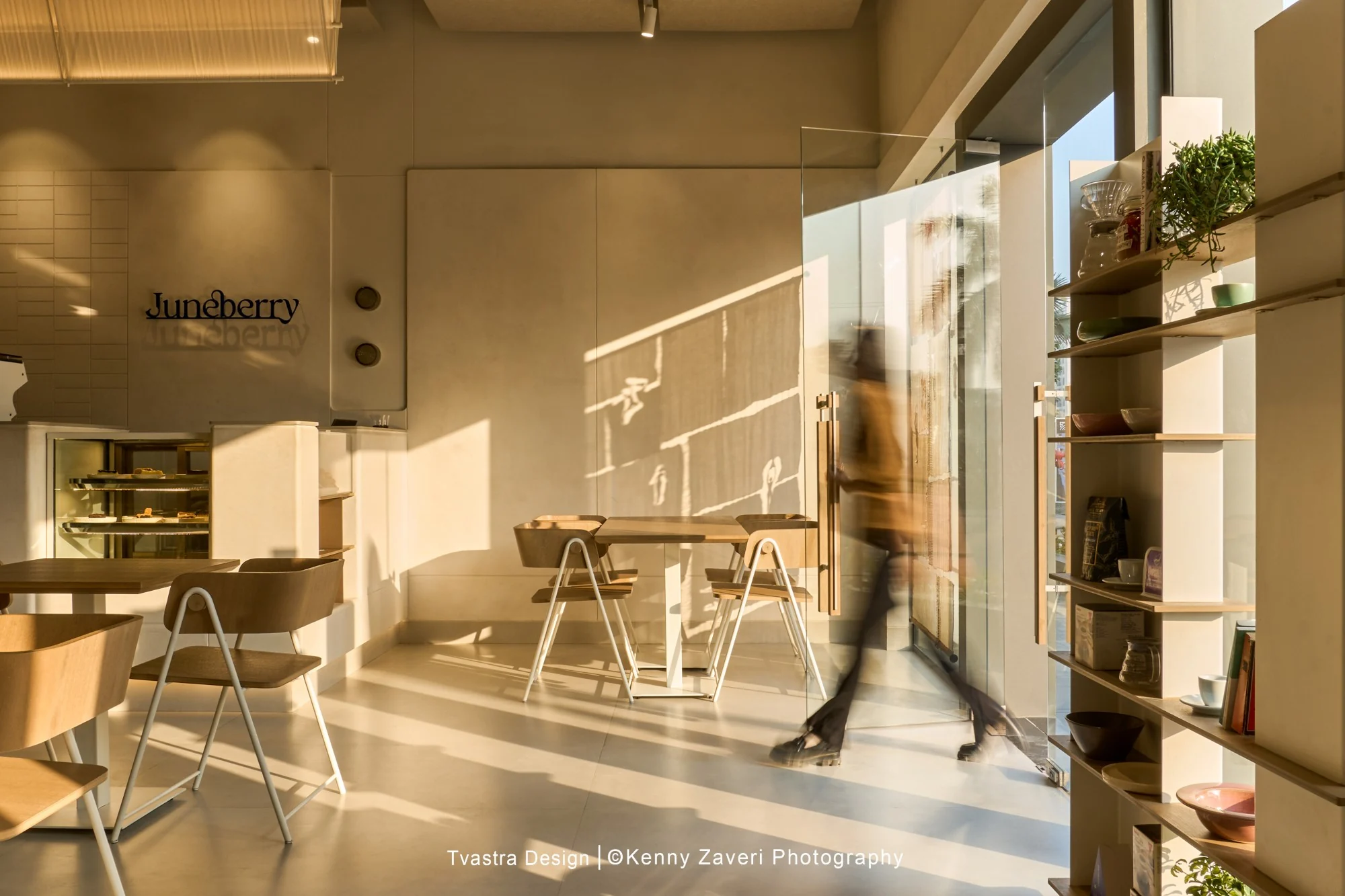 Juneberry, seating and retail shelving toward the entrance