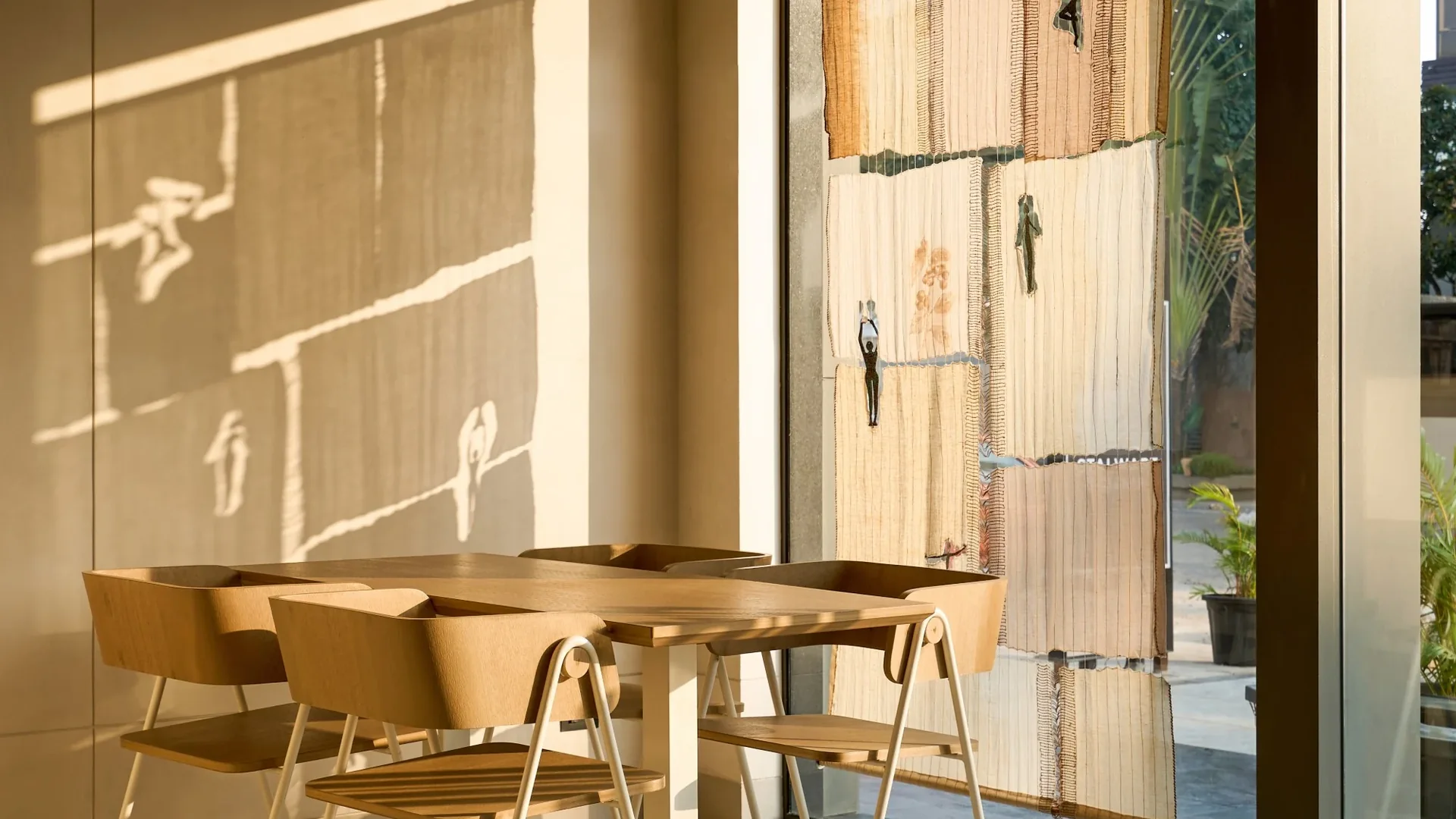 Juneberry, window seating beside an upcycled textile installation