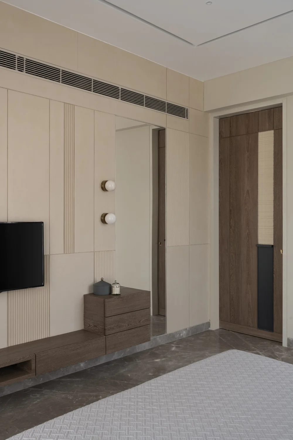 Pyramid Palacia, bedroom with fluted panelling and a media wall
