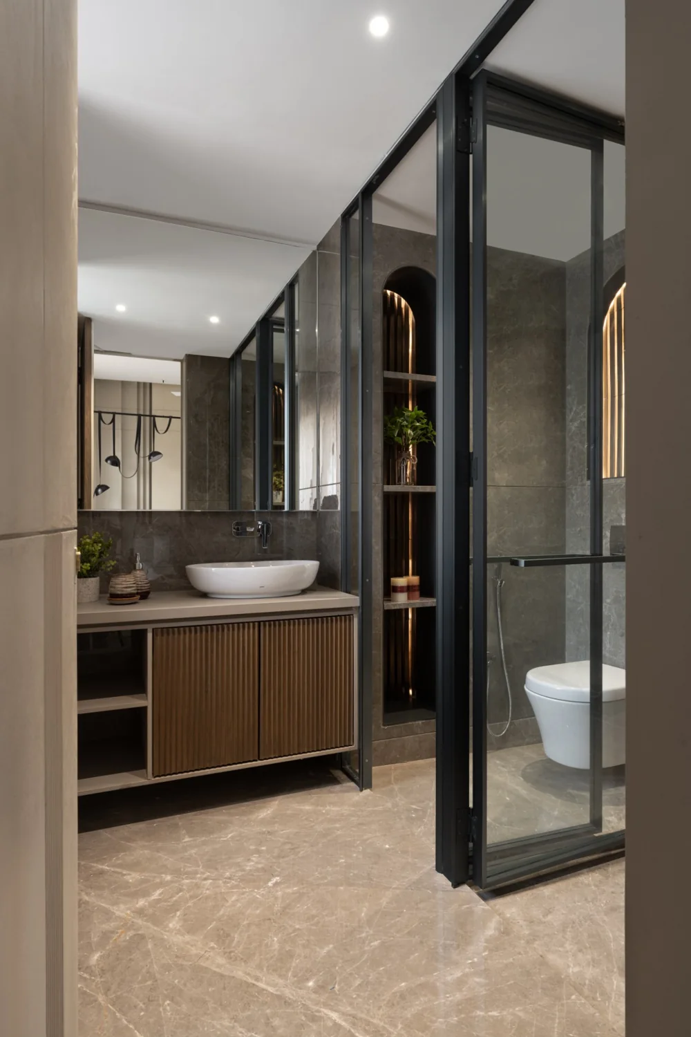 Pyramid Palacia, ensuite bathroom with a glazed partition and timber vanity