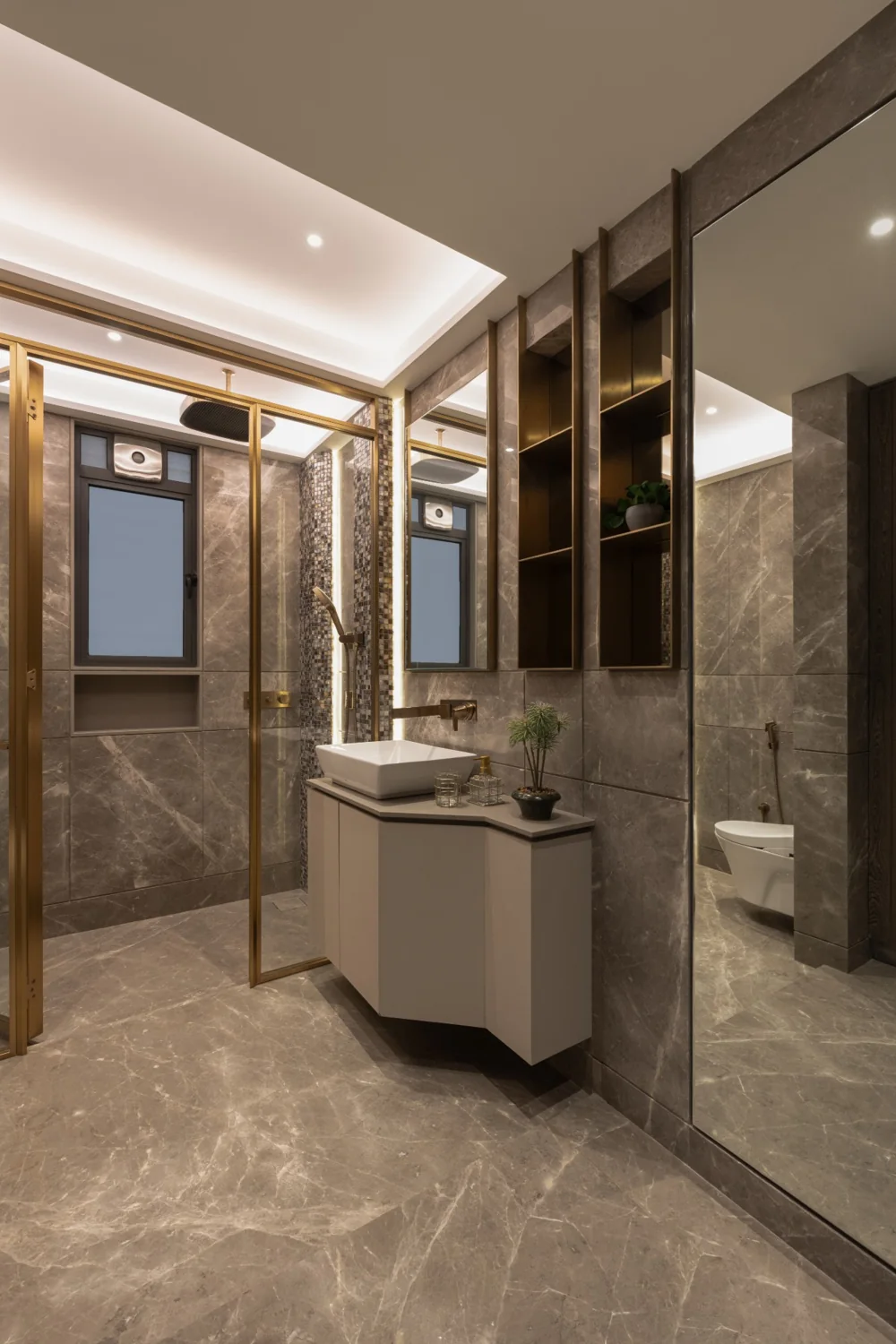 Pyramid Palacia, marble bathroom framed in brushed brass